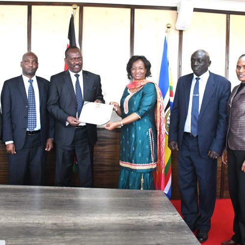 Secretary, National Cohesion and Values, Mr. Josiah Musili, EBS, presenting a certificate of exemplary performance on national cohesion and values PC indicator, 2021- 22 to the Principal Secretary, Ministry of Health.